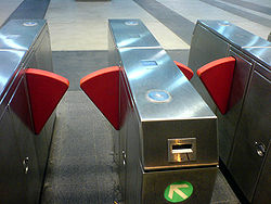 Clipper reader is located on top of the fare gate.
